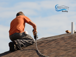 man working on roof